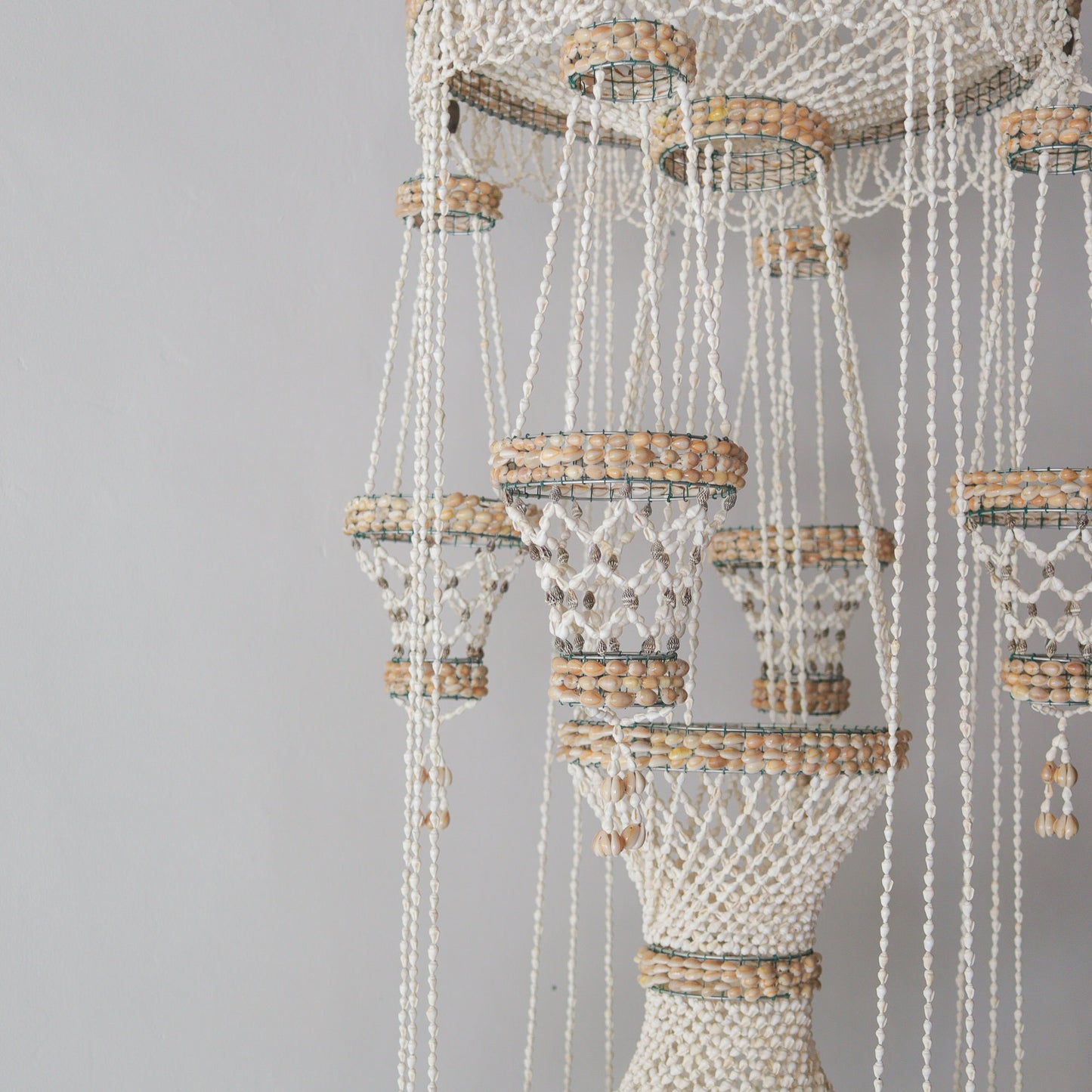 Handmade sea shell chandelier for pot decoration, crafted with natural materials in Bali, Indonesia.