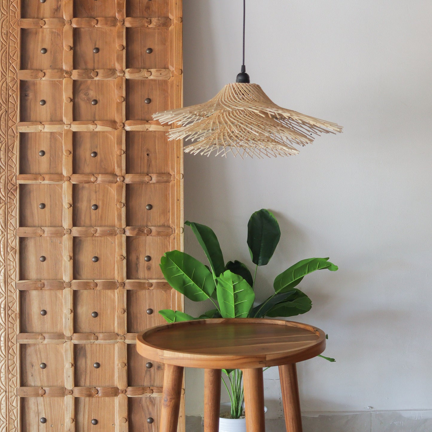 Handcrafted Rattan Pendant Light, tiered Jerami design, illuminating a modern space with natural elegance.