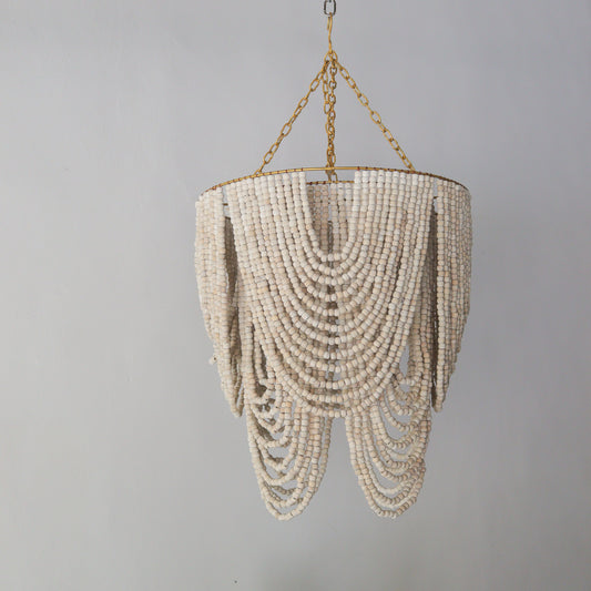 Elegant beaded chandelier with white wash design, handcrafted in Bali, ideal for stylish home decor.