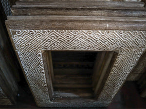 Hand-carved wooden frame with intricate Balinese geometric pattern, rustic home decor
