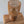 Handcrafted Bali wooden table lamp with woven rattan shade on rustic wood surface