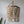 Bohemian beaded chandelier with natural wood beads in a modern minimalist interior setting