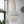 Handmade capiz shell chandelier with layered white shells hanging in a bright modern room