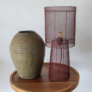 red maroon chainmail table lamp in the room