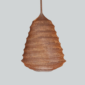 Handwoven copper mesh chandelier with organic, tiered design on a plain background