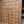 Hand-carved double wooden door with intricate panel design and decorative metal handles