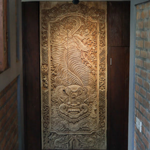 Hand-carved Balinese wooden wall panel with intricate ethnic dragon and floral motifs