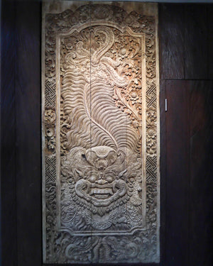 Hand-carved wooden wall panel with intricate Balinese floral and mythological motifs