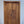 Hand-carved wooden door with intricate Balinese floral design, luxury entryway decor