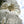 Handcrafted Balinese garden parasols with white crochet and fringe details outdoors