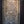 Hand-carved Balinese wooden wall panel with intricate floral and mythical face design