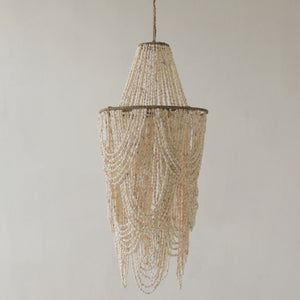 Handmade seashell bead chandelier with cascading layers in a neutral home decor style