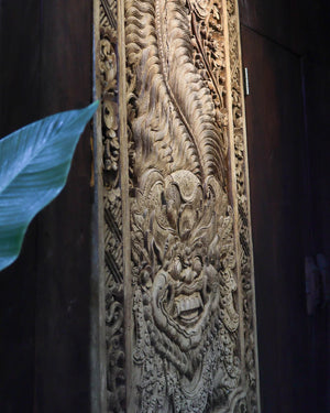 Hand-carved Balinese wooden wall panel with intricate traditional detailing