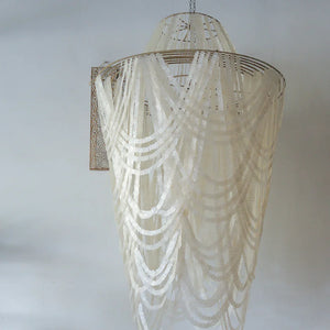 Handmade Balinese seashell chandelier with cascading white shell strands