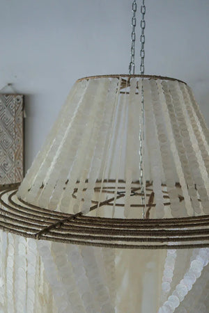 Handmade Balinese seashell chandelier with cascading shell strands and natural rope accent