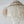 Decorative chandelier made of white shell-like material on a plain background