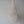 Handmade Balinese seashell chandelier with intricate bead strands on a plain wall