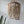 Handmade wooden bead chandelier with natural finish hanging in a minimalist interior