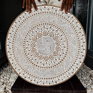 Hand carved ethnic wall panel decoration featuring intricate geometric patterns, handmade in Bali, Indonesia.