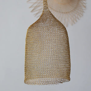 Handwoven rattan pendant light with intricate mesh design on a white background