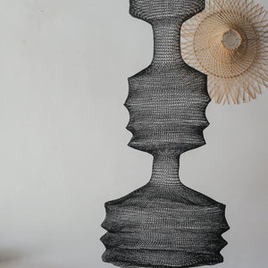 Handmade black woven pendant lamp with organic curves, minimalist decor accent