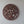 Hand-carved wooden tree of life wall art with intricate roots and leaves on a plain wall