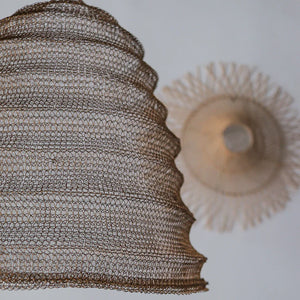 Handwoven rattan pendant lamp with intricate pattern, modern eco-friendly home decor