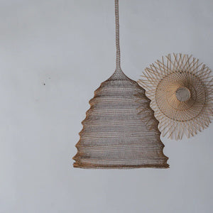 Handwoven rattan pendant lights against a minimalist white wall, Balinese home decor