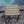 Eco-friendly woven rope stool with wooden frame by a stone poolside