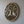 Hand-carved wooden wall decor in gold, featuring a round tree of life design