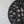 Hand-carved black wood wall art with leaf design on a white background