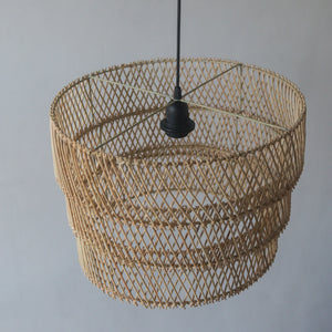 Handcrafted rattan pendant light with tiered design, showcasing unique craftsmanship from Bali, Indonesia.