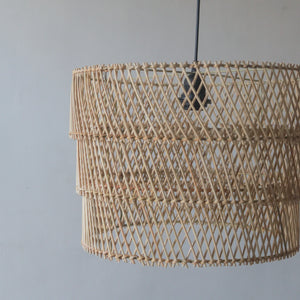 Handcrafted tiered rattan pendant light showcasing intricate weaving and unique design from Bali, Indonesia.