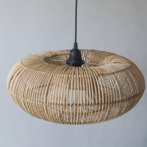 Handcrafted rattan pendant light in donut design, showcasing unique artisanal craftsmanship from Bali, Indonesia.