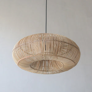 Handcrafted rattan pendant light in donut design, showcasing unique artisanal craftsmanship from Bali, Indonesia.