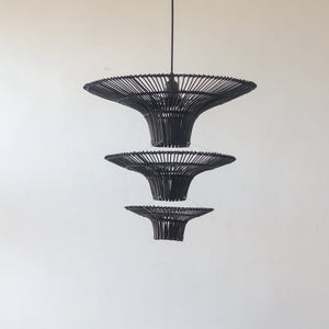 Handcrafted black rattan chandelier pendant light with three tiers, showcasing unique artisan design from Bali.