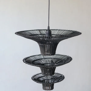 Handcrafted black rattan chandelier featuring unique tiers, inspired by Bali artisan design.