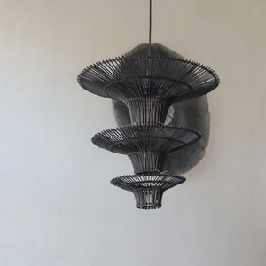 Handcrafted Black Rattan Chandelier, three-tiered pendant light showcasing intricate design from Bali, Indonesia.