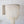 Large Balinese seashell chandelier with intricate bead strands, boho wall art in background