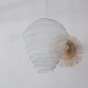 Handmade woven pendant lamp with textured white design, eco-friendly Balinese home decor.