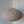Round beige fabric pendant lamp with minimalist design hanging indoors