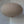 Handmade beige fabric pendant lamp with round shape, hanging in a minimalist interior
