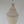 Handmade Balinese seashell chandelier with intricate woven design against a plain background