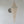 Handmade Balinese seashell chandelier hanging on a white wall, boho home decor