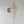 Handcrafted Balinese seashell chandelier with intricate beaded design on a white wall