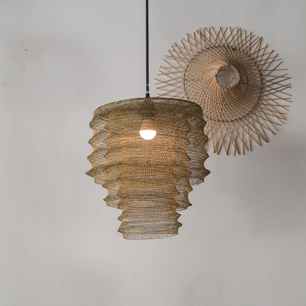 Woven Mesh pendant light with a textured design on a plain background
