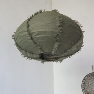 Handcrafted olive green fabric pendant light with frayed edges, Balinese decor style