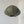 Handmade olive green fabric pendant light with frayed edges hanging in a minimalist room