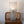 Handmade wire mesh table lamp on wooden chair with woven cane backrest