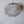 Handmade wire mesh pendant lamp with organic shape against a white wall